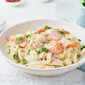 Honey salmon ribbon noodles with carrots